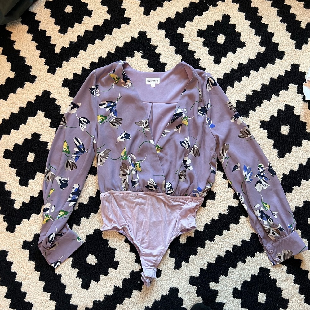 Floral print long sleeve bodysuit with button closure and button sleeves